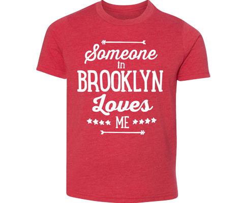 Brooklyn youth tee. Someone in Brooklyn Loves Me print on a heather red kids tee. A handmade t-shirt for kids in Brooklyn, New York. 