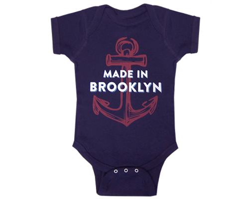 Brooklyn onesie. Made in Brooklyn print with an anchor design. A navy blue baby onesie handmade for babies and parents to be in Brooklyn New York.
